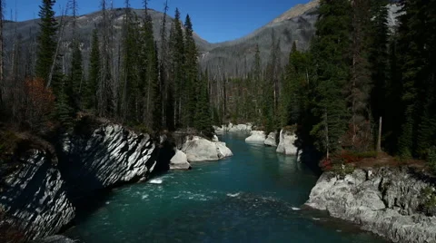 TURQUOISE BLUE RIVER FLOWS THROUGH WHITE GRANITE CANYON Stock Footage 59073224