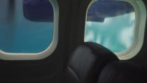 Turquoise blue sea view from inside of small plane Stock Footage 168777172