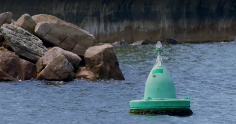Turquoise Buoy Floating on Water Stock Footage 164908039