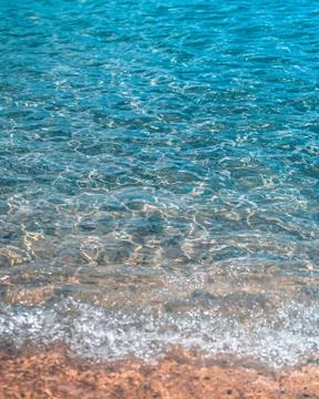 Turquoise Caribbean waves washing ashore the beach in St. Lucia Stock Photos