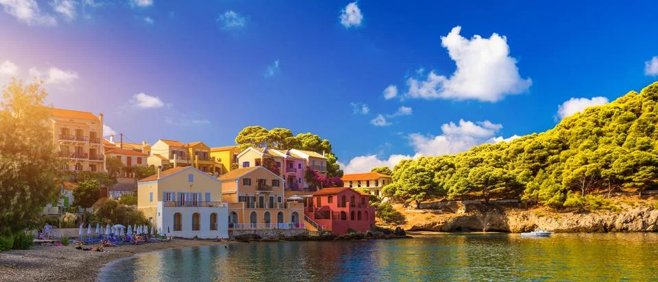 Turquoise colored bay in Mediterranean sea with beautiful colorful houses i.. Stock Photos