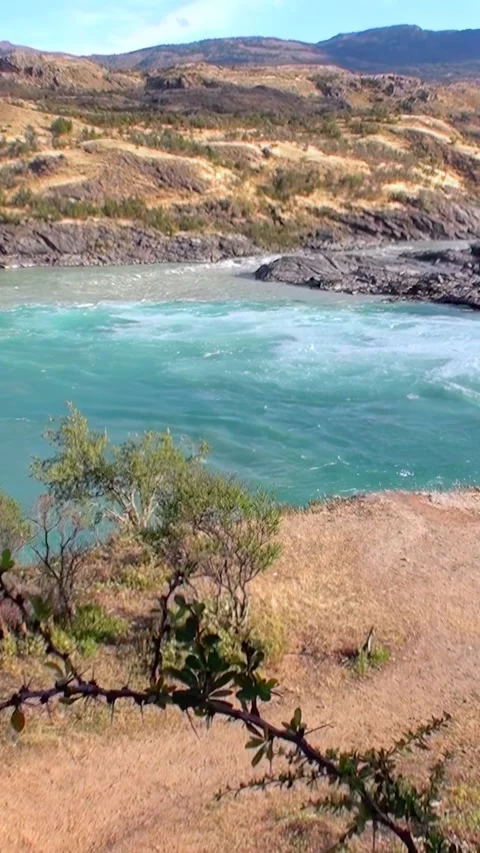 Turquoise Currents Flow Through Arid Patagonia Landscape Stock Footage 327098454