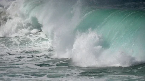 Turquoise foamy huge sea waves slowly crushing against the coast. Slow motion Stock Footage