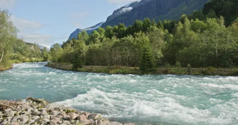 Turquoise Glacial River with Rapids in a Forested Mountain Valley, Norway Stock Footage 326354566