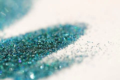 Turquoise glitter on light background - macro photo Stock Photos