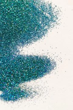 Turquoise glitter on light background - macro photo Stock Photos