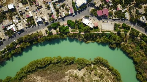 Turquoise Goksu River flowing between old roman district, Mersin, Turkey Video stock 119898278