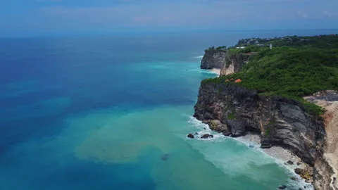 Turquoise Indian Ocean Against Steep Cliffs on Bali Coastline, Indonesia Stock Footage 345216852