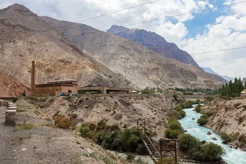 Turquoise Iskander Darya river flows through mountain valley in Tajikistan Stock Photos