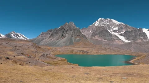 Turquoise lagoon in the middle of the mountains Stock Footage 281459264