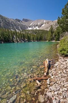 Turquoise Lake in a Mountain Basin Stock Photos