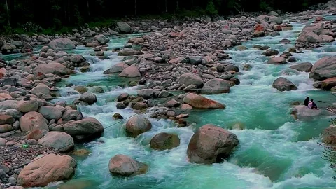 Turquoise Mountain River Flowing Through Rocky Riverbed Stock Footage 341816521