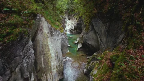 Turquoise mountain river stream flowing through scenic Rettenbach gorge and 库存影片 345236182