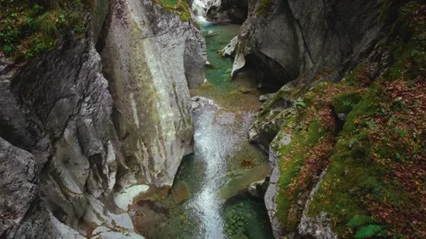Turquoise mountain river stream flowing through scenic Rettenbach gorge and Stock Footage 345557151