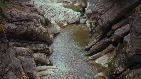 Turquoise mountain river stream flowing through scenic Rettenbach gorge and Stock Footage 345557347