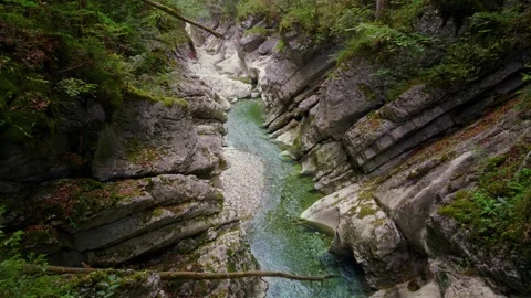 Turquoise mountain river stream flowing through scenic Rettenbach gorge and Stock Footage 345557435