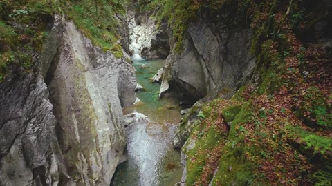 Turquoise mountain river stream flowing through scenic Rettenbach gorge and Stock Footage 345557567