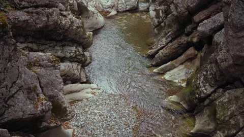Turquoise mountain river stream flowing through scenic Rettenbach gorge and Stock Footage 345557599