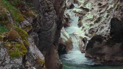 Turquoise mountain river stream flowing through scenic Rettenbach gorge and Stock Footage 345557661