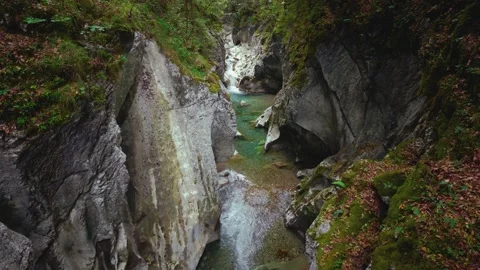 Turquoise mountain river stream flowing through scenic Rettenbach gorge and Stock Footage 345557748