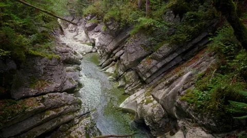 Turquoise mountain river stream flowing through scenic Rettenbach gorge and Stock Footage 345557847