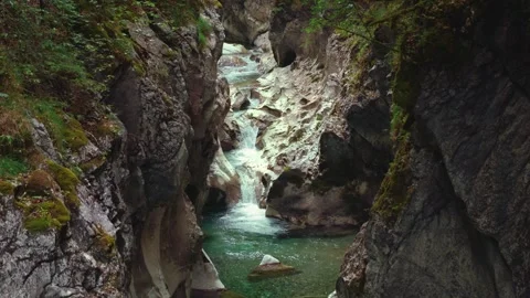 Turquoise mountain river stream flowing through scenic Rettenbach gorge and Stock Footage 345558131