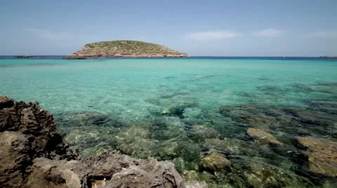 Turquoise ocean with island Stock Footage 24368341