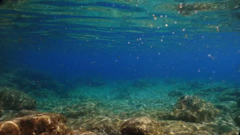 Turquoise ocean / sea, rays of the sun on the bottom. Beautiful background recor Stock Footage 121971413