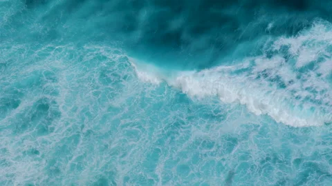 Turquoise ocean sea water white wave pattern splashing deep blue sea Stock Footage 277557504