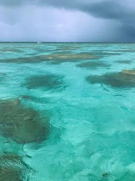Turquoise Ocean Under Cloudy Sky Stock Photos