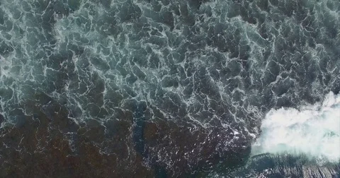 Turquoise ocean water aerial top view. Ocean waves and white foam from the top. Stock Footage