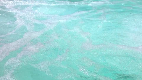 Turquoise ocean water with foamy waves captured in 4K Stock Footage 283280366