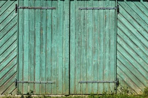 Turquoise painted rustic barn door Stock Photos