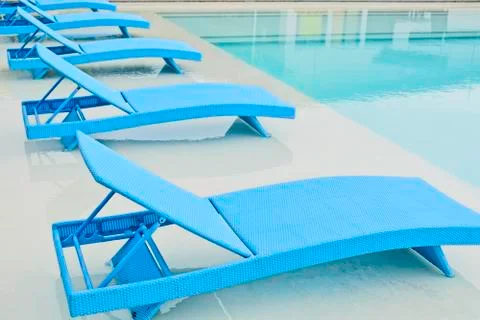 Turquoise pool benches Stock Photos
