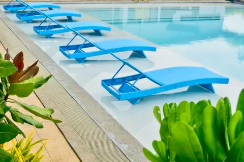 Turquoise pool benches Stock Photos