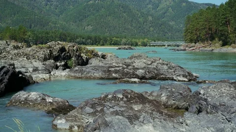 Turquoise river flowing between the rocks Video stock 79663535