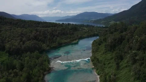 Turquoise River Flowing into a Lake Stock Footage 303082889