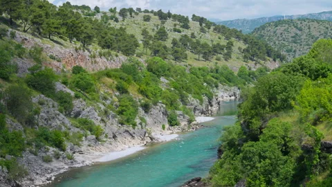 Turquoise river flowing through a rocky green canyon in the mountains Vídeos de archivo 339467409
