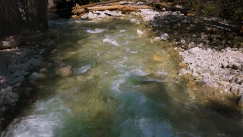A Turquoise River Moves Forth Stock Footage 251328795