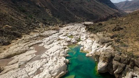 Turquoise river pool in white limestone canyon Stock Photos