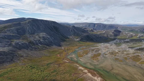 Turquoise river threading a broad tundra valley, Lavrentiya Bay, Chukotka Stock Footage 327126833