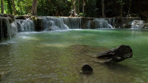 Turquoise River Water Cascading Over Limestone Tiers At Huai Mae Khamin Wat.. Video stock 341645860