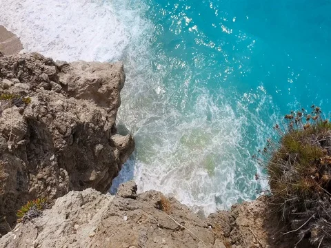 Turquoise sea and big waves crashing on the rocks on the Greek island, Lefkada Stock Footage 80053470