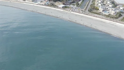 The turquoise sea is bordered by a pebble beach Video stock 134744127