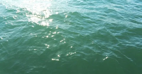 Turquoise Sea with Dappled Light Stock Footage 128367023