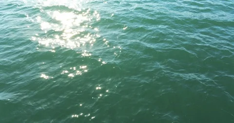 Turquoise Sea with Dappled Light Stock Footage 128368202