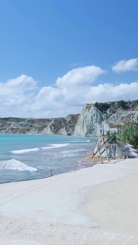 Turquoise sea gently lapping on white sand beach Stock Footage 294963998