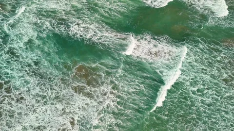Turquoise sea waves reaching the shore, symbolizing travel and sunny summer Video stock 341375776