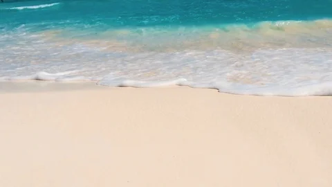Turquoise sea waves on sand Stock Footage 107828558