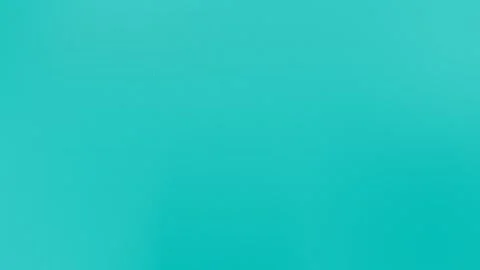 Turquoise seamless loop background texture with subtle gradient and fine grain. Stock Footage 309058626